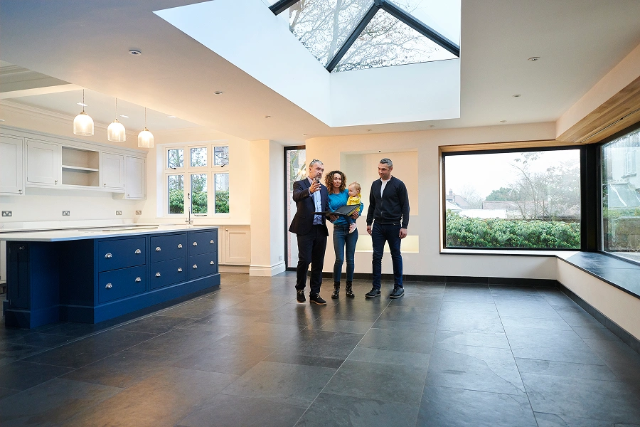 Couple viewing spacious home interior