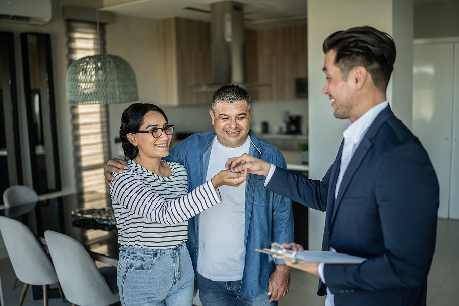 Happy couple getting new home keys