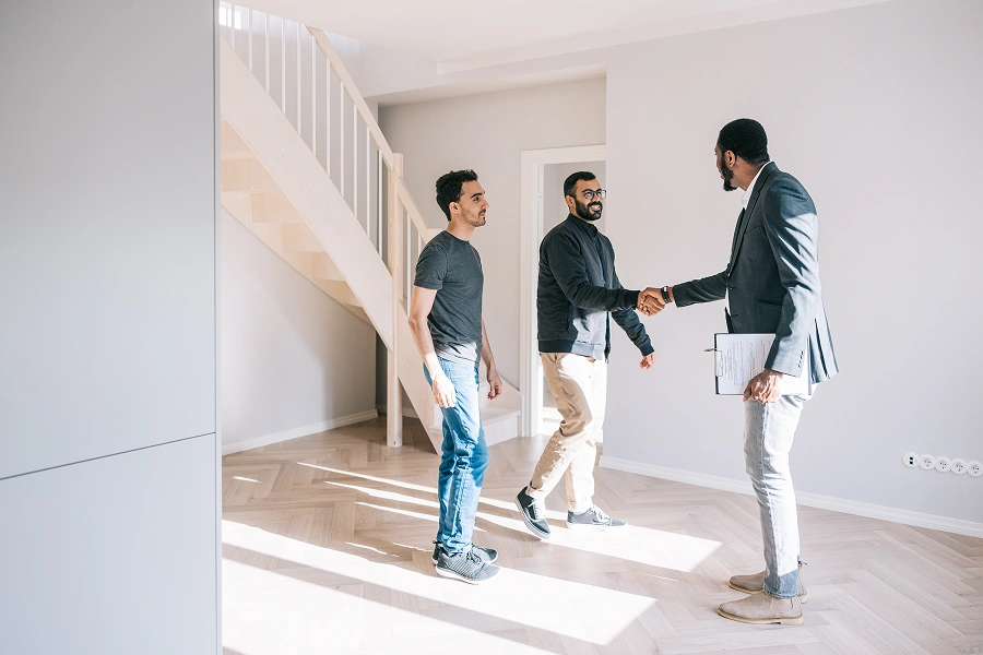 Real estate agent showing house to clients