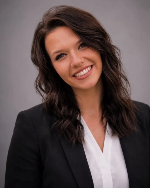 Smiling professional woman in blazer and blouse