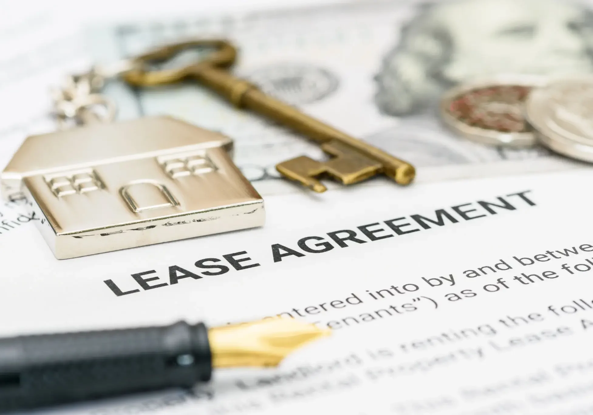 Lease agreement with house key and pen